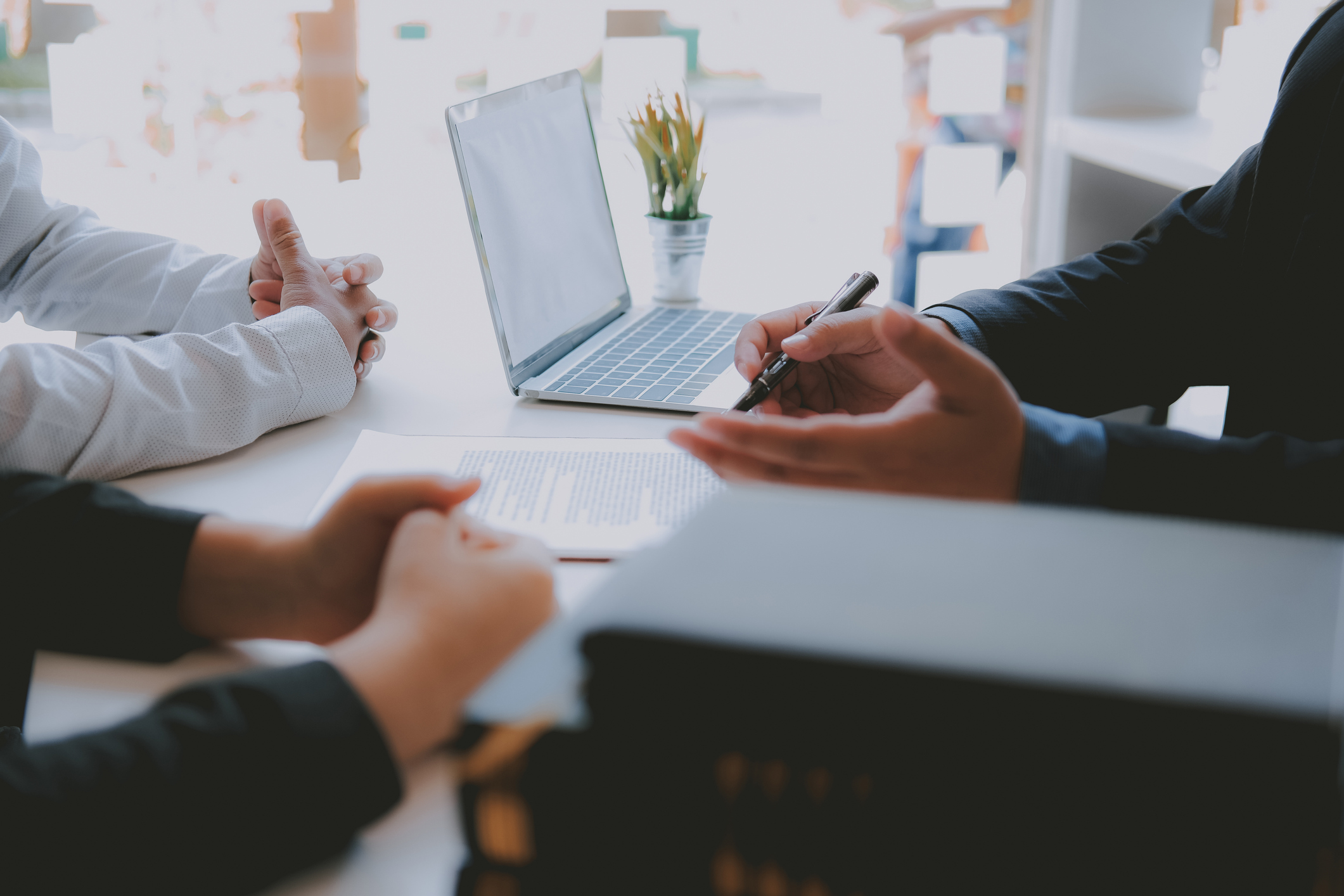lawyer insurance broker consulting giving legal advice to couple customer about buying renting house. financial advisor with mortgage loan investment contract. realtor selling real estate